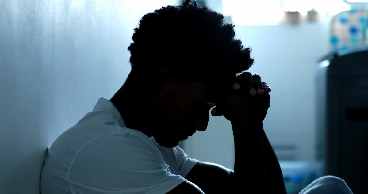 Worried black man feeling anxiety and worry